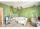 Green themed bedroom with daybed, vanity and hanging swing at 2816 Ivy Lake Ct, Lakeland, FL 33811