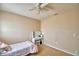 Bedroom featuring a ceiling fan, vanity and ample natural light at 2816 Ivy Lake Ct, Lakeland, FL 33811