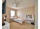 Bedroom featuring a ceiling fan, mounted TV and vanity at 2816 Ivy Lake Ct, Lakeland, FL 33811