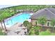 Relax in style at the community pool featuring lounge chairs, tables and a splash pad for endless summer fun at 2816 Ivy Lake Ct, Lakeland, FL 33811