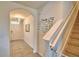 Entryway featuring tile flooring, archway to front door, and carpeted stairs with Gathering decor at 2816 Ivy Lake Ct, Lakeland, FL 33811