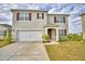 Attractive two-story home featuring a two-car garage and well-manicured front yard at 2816 Ivy Lake Ct, Lakeland, FL 33811
