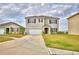 Charming two-story home with a well-maintained lawn and a spacious driveway at 2816 Ivy Lake Ct, Lakeland, FL 33811