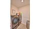 The laundry room features new front loading machines and storage at 2816 Ivy Lake Ct, Lakeland, FL 33811