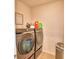 The laundry room features new front loading machines and storage at 2816 Ivy Lake Ct, Lakeland, FL 33811