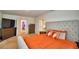 Spacious primary bedroom featuring carpet, a dresser, and tv at 2816 Ivy Lake Ct, Lakeland, FL 33811
