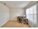 Bright home office space featuring a computer desk, rolling chair, and natural light from a window at 2816 Ivy Lake Ct, Lakeland, FL 33811