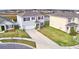 Street view of well-maintained two-story homes with attached garages, landscaped yards and inviting driveways at 2816 Ivy Lake Ct, Lakeland, FL 33811