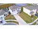Street view of modern two-story homes with garages, landscaped yards and driveways in a Gathering-friendly neighborhood at 2816 Ivy Lake Ct, Lakeland, FL 33811