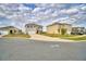 Attractive street view of well-maintained two-story homes with neat landscaping and driveways at 2816 Ivy Lake Ct, Lakeland, FL 33811