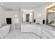 Elegant bathroom features marble countertops, dual sinks, a soaking tub, and sophisticated fixtures at 2859 Medinah Cir, Lakeland, FL 33803