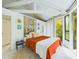 Serene bedroom with orange bedding and Buddha art at 2907 Marion Way # 2907, Haines City, FL 33844