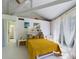 Bright bedroom with yellow bedspread, high ceilings, and sliding glass doors at 2907 Marion Way # 2907, Haines City, FL 33844