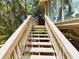 Wooden staircase leading to an elevated deck at 2907 Marion Way # 2907, Haines City, FL 33844
