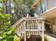 Wooden staircase leading to elevated home's deck at 2907 Marion Way # 2907, Haines City, FL 33844