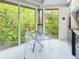 Kitchen features glass table for four and wooded view at 2907 Marion Way # 2907, Haines City, FL 33844