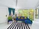 L-shaped blue sofa dominates this living room at 2907 Marion Way # 2907, Haines City, FL 33844