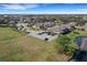 Expansive aerial view showcases a well-planned community with homes, green spaces, ponds, and parking areas at 3019 Mission Lakes Dr, Lakeland, FL 33803