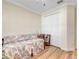 Bedroom featuring wood floors, a ceiling fan, and a large closet with white doors at 3019 Mission Lakes Dr, Lakeland, FL 33803