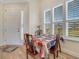 Dining area with bright window light and shutters, next to the front door at 3019 Mission Lakes Dr, Lakeland, FL 33803