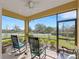 Relaxing screened lanai with comfortable seating and a ceiling fan for a cool breeze at 3019 Mission Lakes Dr, Lakeland, FL 33803