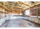 Interior of the shed with wooden walls, shelves, and concrete foundation at 306 Estrella Way, Auburndale, FL 33823