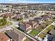 Wide aerial view of neighborhood, featuring well-kept lawns, close proximity to shopping and entertainment areas at 3460 Canvas St, Kissimmee, FL 34741