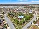 An aerial neighborhood shot captures the well-spaced homes and community areas at 3460 Canvas St, Kissimmee, FL 34741