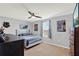 Bedroom with grey walls, neutral carpet, ceiling fan, and a window with blinds at 3460 Canvas St, Kissimmee, FL 34741