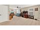 Bonus room with desk, love seat, and TV entertainment center at 3460 Canvas St, Kissimmee, FL 34741
