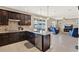 Beautiful kitchen features an island with seating and stainless-steel appliances at 3460 Canvas St, Kissimmee, FL 34741