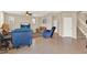 Spacious living room features neutral walls, tile floors, natural light, and access to upstairs at 3460 Canvas St, Kissimmee, FL 34741