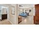 Spacious living room with tile floors, a powder room, and an adjacent dining area at 3460 Canvas St, Kissimmee, FL 34741