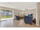 Open concept living room boasts tile floors, natural light, and access to a large backyard at 3460 Canvas St, Kissimmee, FL 34741