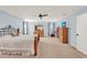 This main bedroom features light blue walls, a ceiling fan, and a comfortable, inviting atmosphere at 3460 Canvas St, Kissimmee, FL 34741