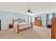 Spacious main bedroom with neutral carpet, ceiling fan, and a large window at 3460 Canvas St, Kissimmee, FL 34741