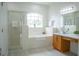 Bright bathroom features a large soaking tub, separate shower, and window for natural light at 3573 Marsh Wren St St, Lakeland, FL 33811