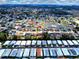 Wide aerial view of the neighborhood near a pond at 3719 Imperial Dr, Winter Haven, FL 33880