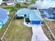 An aerial view showing the home's location, landscaping, and proximity to a nearby pond at 3719 Imperial Dr, Winter Haven, FL 33880