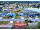 Aerial view of the property with surrounding homes and a nearby pond at 3719 Imperial Dr, Winter Haven, FL 33880