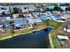 Aerial view of a home near a pond and other houses in the neighborhood at 3719 Imperial Dr, Winter Haven, FL 33880