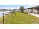Spacious backyard with a partial view of the waterfront at 3719 Imperial Dr, Winter Haven, FL 33880