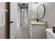 Second bathroom with tile floors, granite counters, and neutral paint palette at 3719 Imperial Dr, Winter Haven, FL 33880