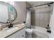 Full bathroom featuring granite counters, tile accents, and shower-tub combination at 3719 Imperial Dr, Winter Haven, FL 33880