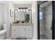 Modern bathroom vanity and shower with beautiful finishes and bright lighting at 3719 Imperial Dr, Winter Haven, FL 33880