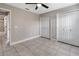 Neutral paint and tile floors adorn this bedroom at 3719 Imperial Dr, Winter Haven, FL 33880