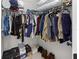 Organized walk-in closet with ample storage space for clothes and shoes at 3719 Imperial Dr, Winter Haven, FL 33880