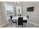 Bright dining nook featuring a table with seating for four and natural lighting at 3719 Imperial Dr, Winter Haven, FL 33880