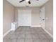 Neutral paint and tile floors adorn this bedroom at 3719 Imperial Dr, Winter Haven, FL 33880