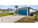 Home with a well-manicured lawn and a vibrant blue garage door at 3719 Imperial Dr, Winter Haven, FL 33880